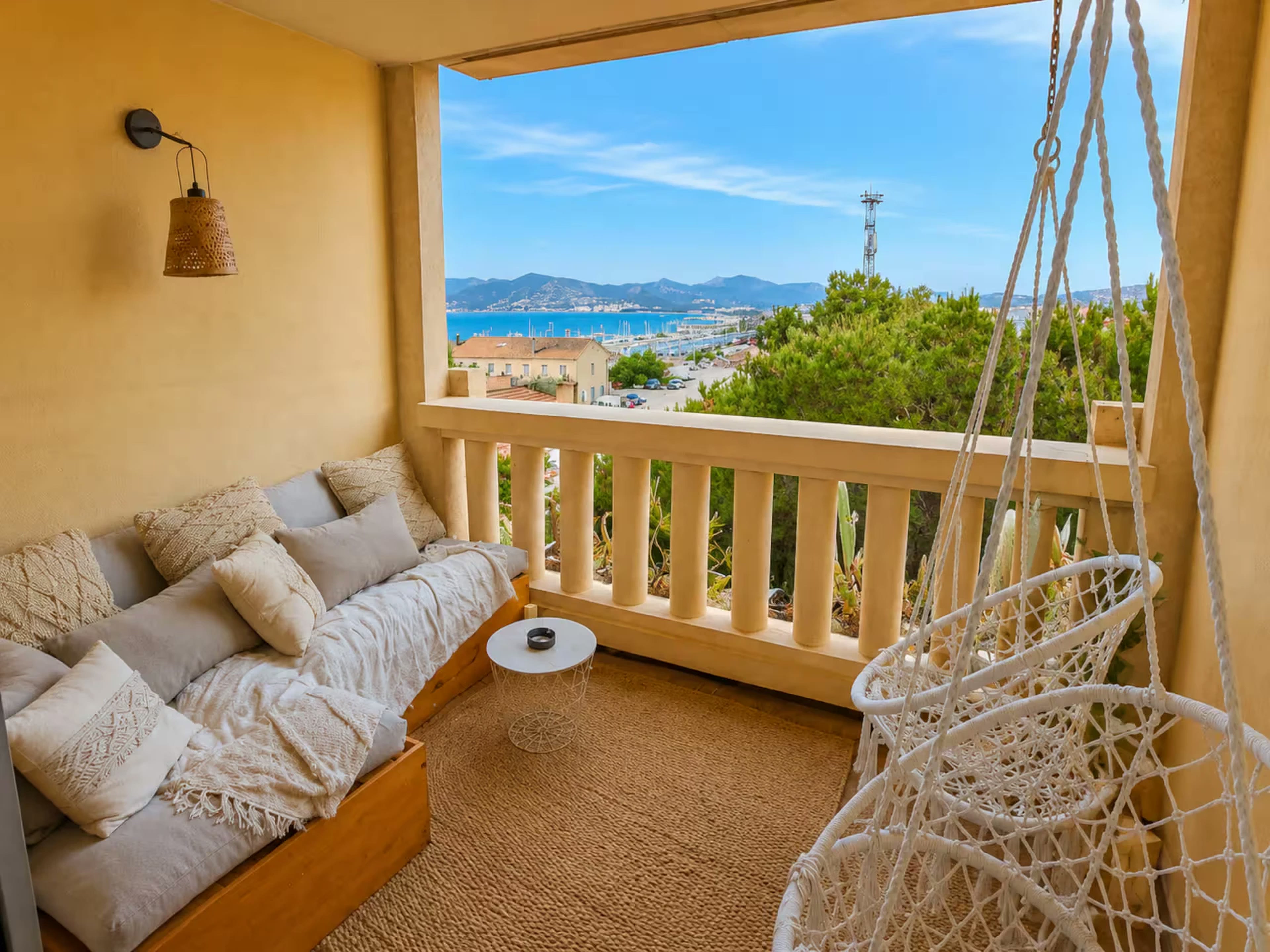 Terrace with sea view and hanging chair in Cannes